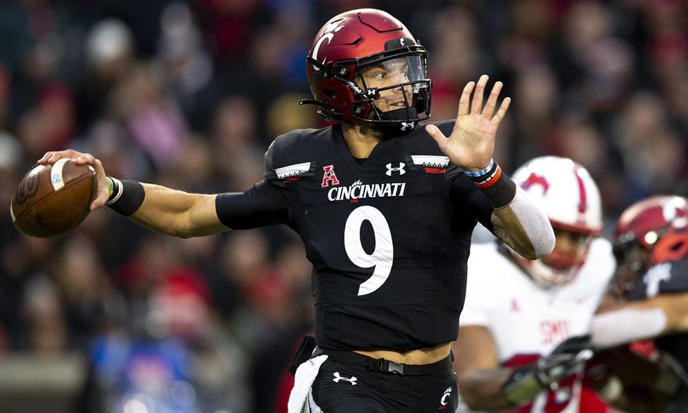 Quarterback Desmond Ridder of the Cincinnati Bearcats throws a pass